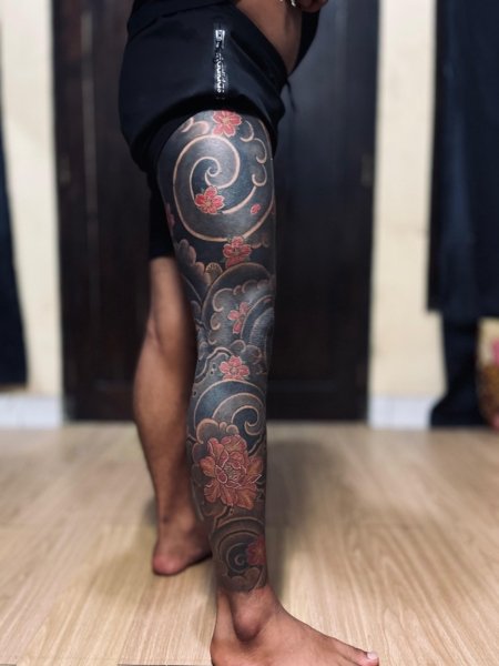 Custom full leg tattoo created at Om Tattoo Studio in North Bali, part of the Tattoo Holiday Bali experience