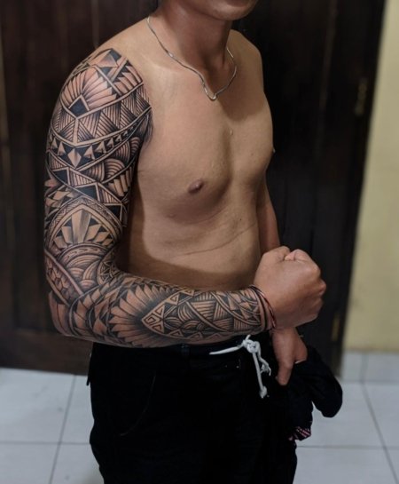 Custom full sleeve tattoo created at Om Tattoo Studio in North Bali, part of the Tattoo Holiday Bali experience